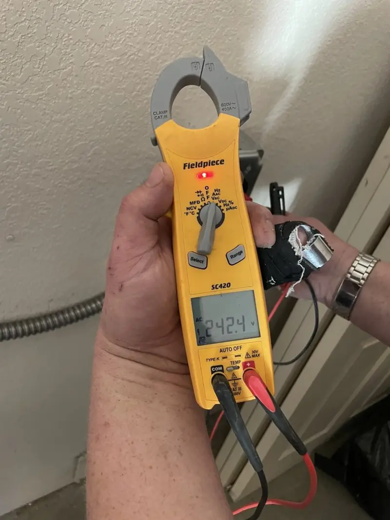 Voltage testing with clamp meter during Whole House Surge Protector in Orofino